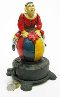   Cast Iron Collectible Spinning Clown Mechanical Coin Bank  
