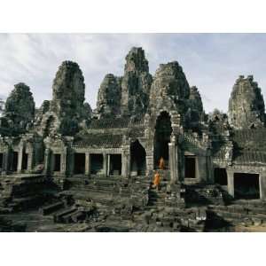  Monks in Orange Robes Stand on the Step Outside a Buddhist 